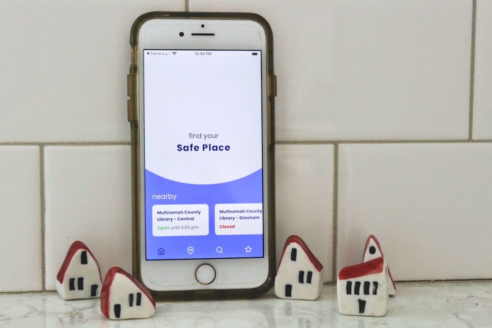 Smartphone displaying Safe Place homescreen with a list of nearby locations
